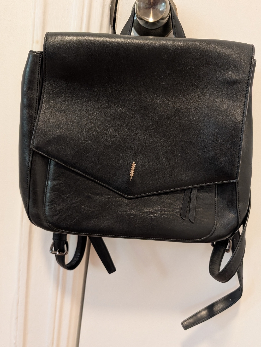 Thacker Black Leather Backpack with Gold Leaf Logo